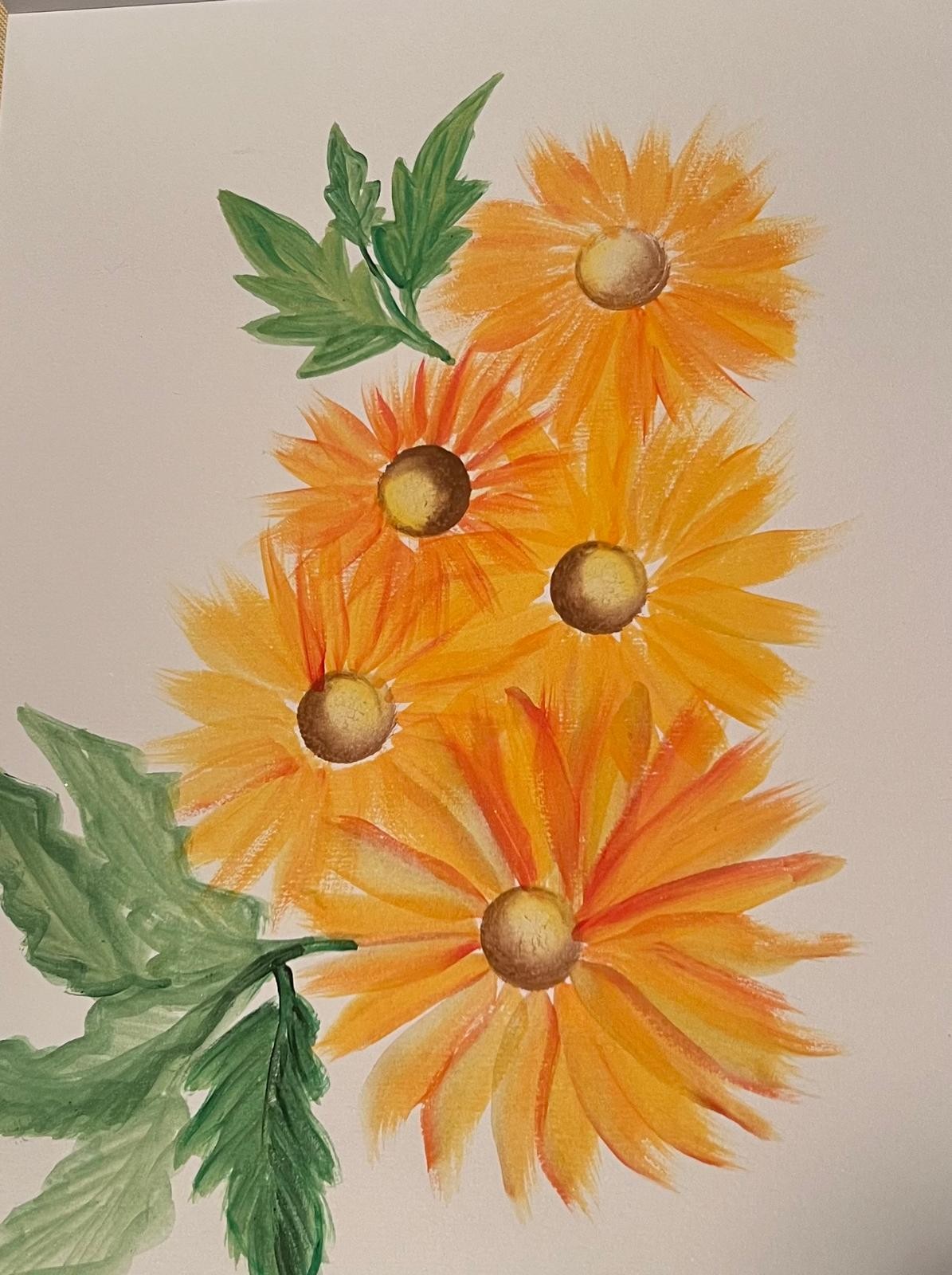 Golden-yellow flowers with rounded brown centres and green leaves on a pale background.
